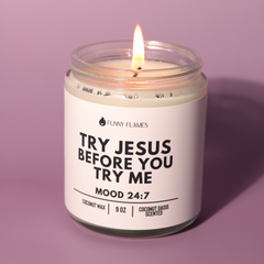 Candle in a glass jar with a label on a purple background