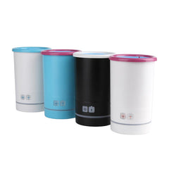 Four cylindrical devices with colorful lids on a white background