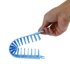 Blue plastic tool held by a hand on a white background