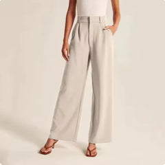 Light gray wide-leg pants worn by a person on a plain background