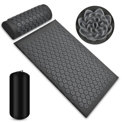 Black acupressure mat with gray nodes and black cylindrical bag on a white background