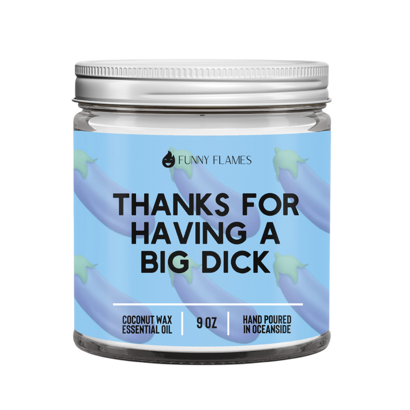 Jar of coconut wax essential oil candle with humorous label on a white background