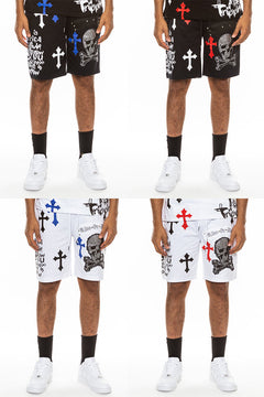 Four different views of shorts with skull and crossbones design on a white background