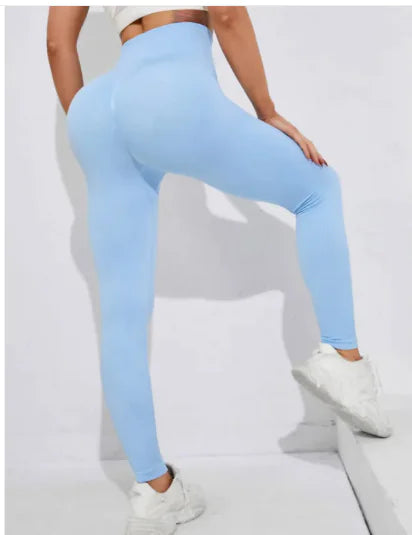 Light blue leggings worn by a person on a white background