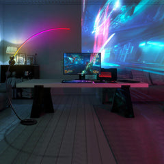 Modern gaming setup with a large screen and colorful lighting in a dimly lit room.