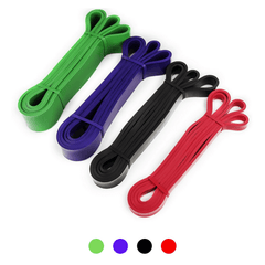 Set of four resistance bands in green, purple, black, and red on a white background.