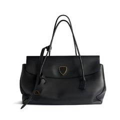 Black handbag with a gold emblem on a white background