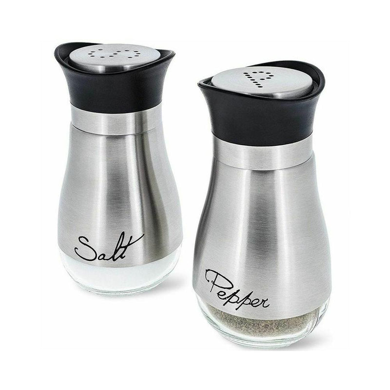 Salt and pepper shakers with black lids on a white background