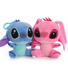 Two plush toys, one blue and one pink, on a white background