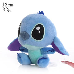Small blue plush toy with purple accents on a white background