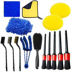 Collection of car cleaning tools including brushes, sponges, and cloths on a white background