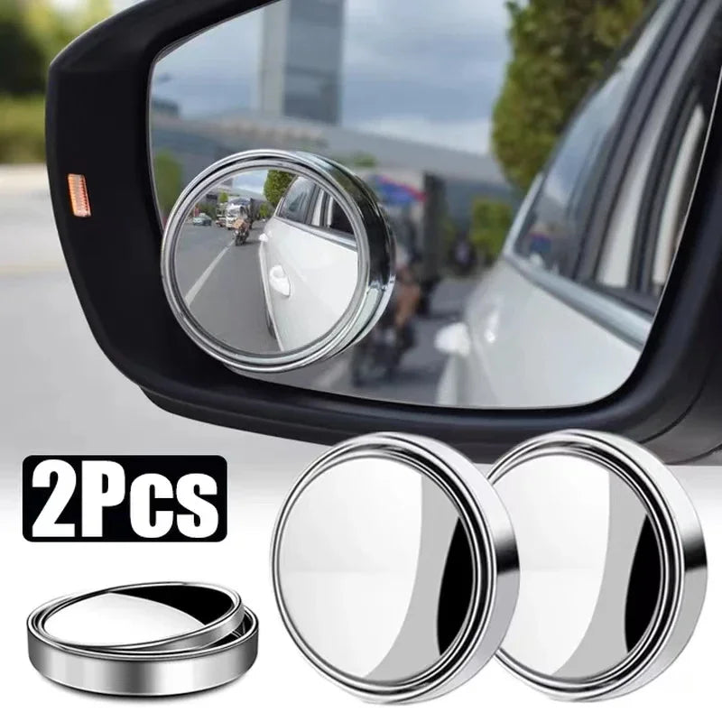Car side mirror with two additional round mirrors attached, showing their reflective surfaces.