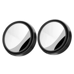 Two round metallic objects with black rims on a white background