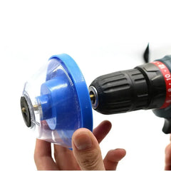 Blue dust collection disc attached to a drill on a white background