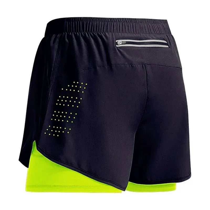 Black athletic shorts with a neon green inner lining on a white background
