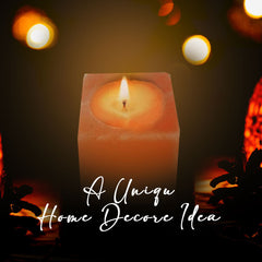 Candle with text 'A Unique Home Decor Idea' on a dark background