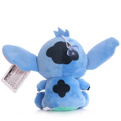 Blue plush toy with a tag on a white background