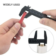 Caliper measuring a red cylindrical object with an inset showing the caliper's measurement scale.