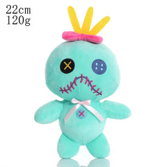 Teal plush toy with a crown on a white background