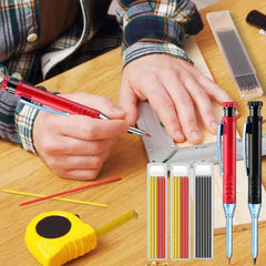 Person using a mechanical pencil with additional pencils and leads on a wooden surface.