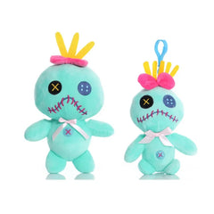 Two turquoise plush toys with colorful hair accessories on a white background