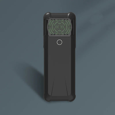 Black electronic device with a green circular component on a dark blue background