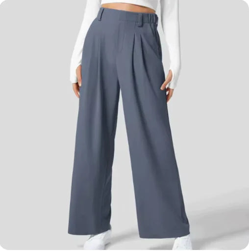 Person wearing blue wide-leg pants on a light gray background