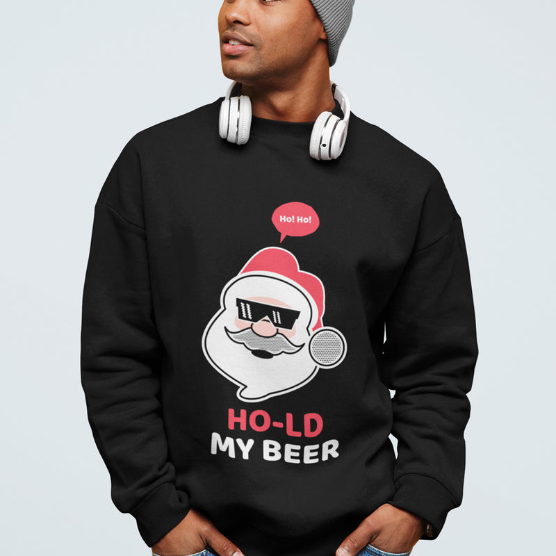 Person wearing a black sweatshirt with a Santa Claus graphic and text 'HO-LD MY BEER' on a light gray background.