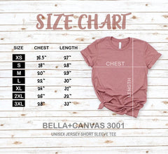 Size chart for Bella+Canvas 3001 t-shirt on a wooden background