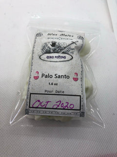 Wax melts in a clear package with a label reading 'Palo Santo' and 'Rebel Potions'.