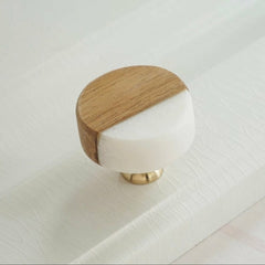 Wooden knobs with white on a white surface