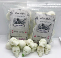 Wax melts shaped like skulls with 'Rebel Potions' packaging on a white background
