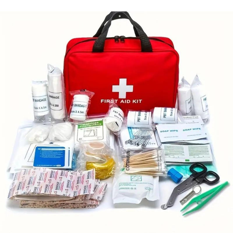 Red first aid kit with various supplies on a white background