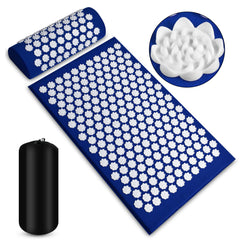 Blue acupressure mat and pillow set, white nodes, with black bag on a white background