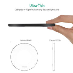 Thin black circular object held by a hand with measurements displayed.