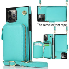 Turquoise phone case with multiple compartments and a leather strap on a white background