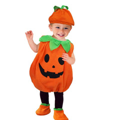 Child wearing a pumpkin costume with a white background
