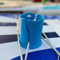Blue cup holder on a paddleboard with a blurred background