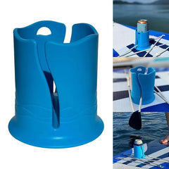 Blue cup holder on a white background, shown on a paddleboard in water.